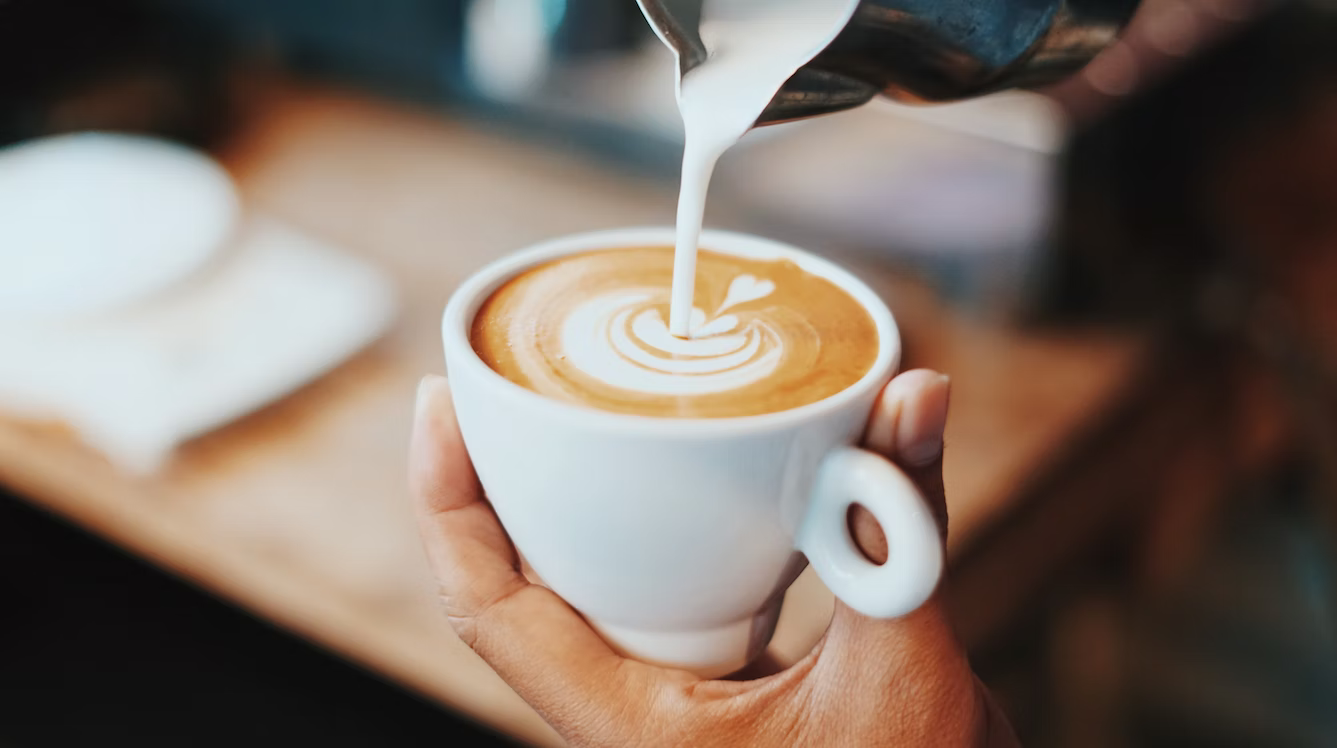 Latte Milk Pour into White Mug